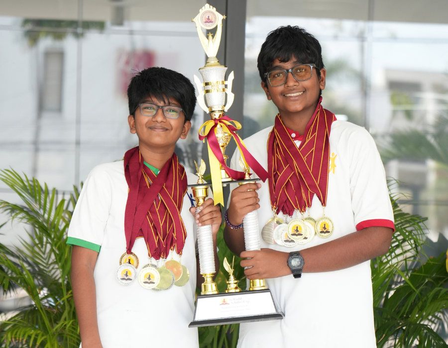 aLphabet scholars celebrating with the World Scholar's Cup trophy