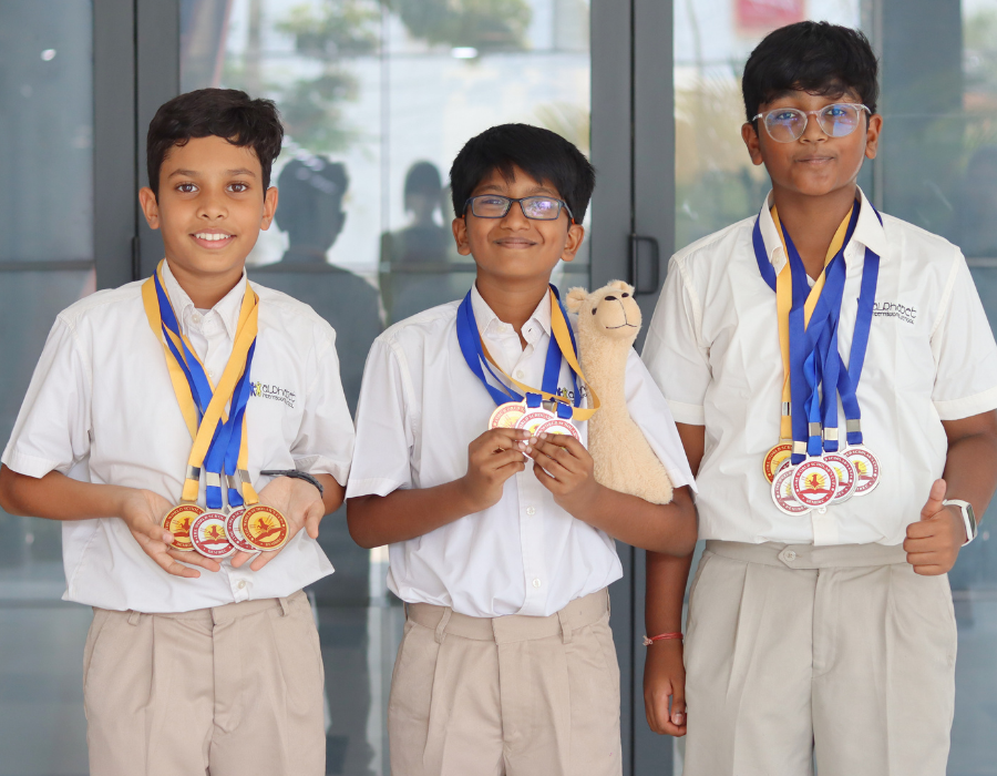 scholars with medals and mascot