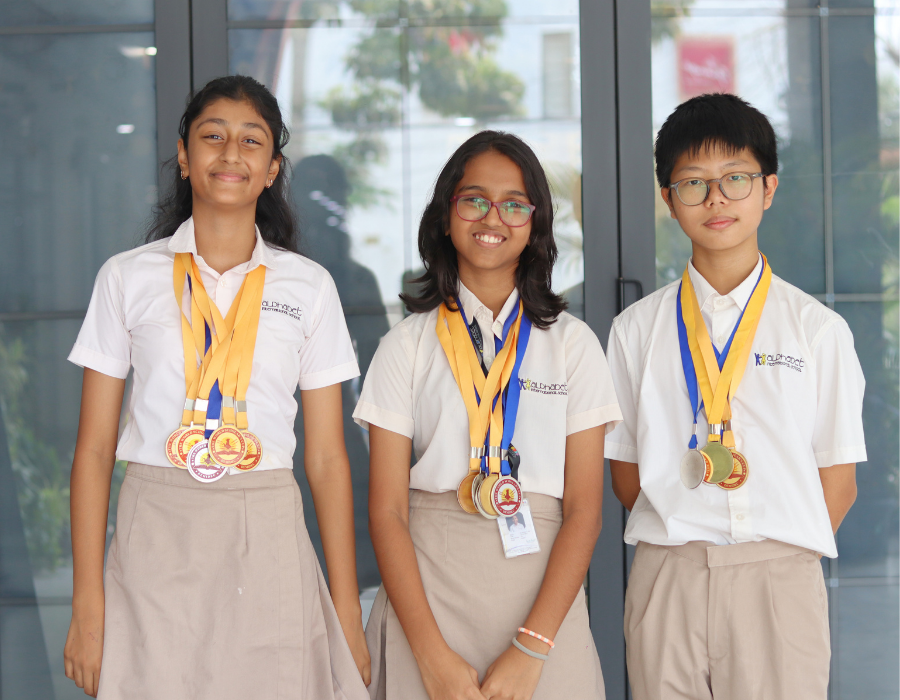 scholars proudly wearing competition medals